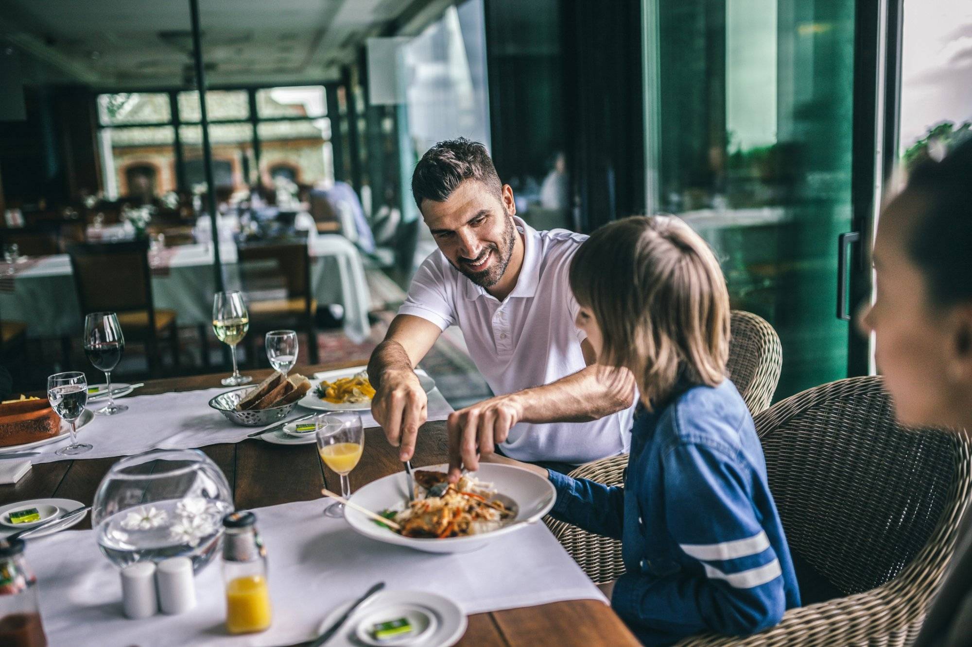 Portrait of happy family eating in the restaurant Portrait of happy family eating in the restaurant