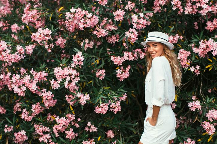 Beautiful girl on the background of spring bush Beautiful girl on the background of spring bush