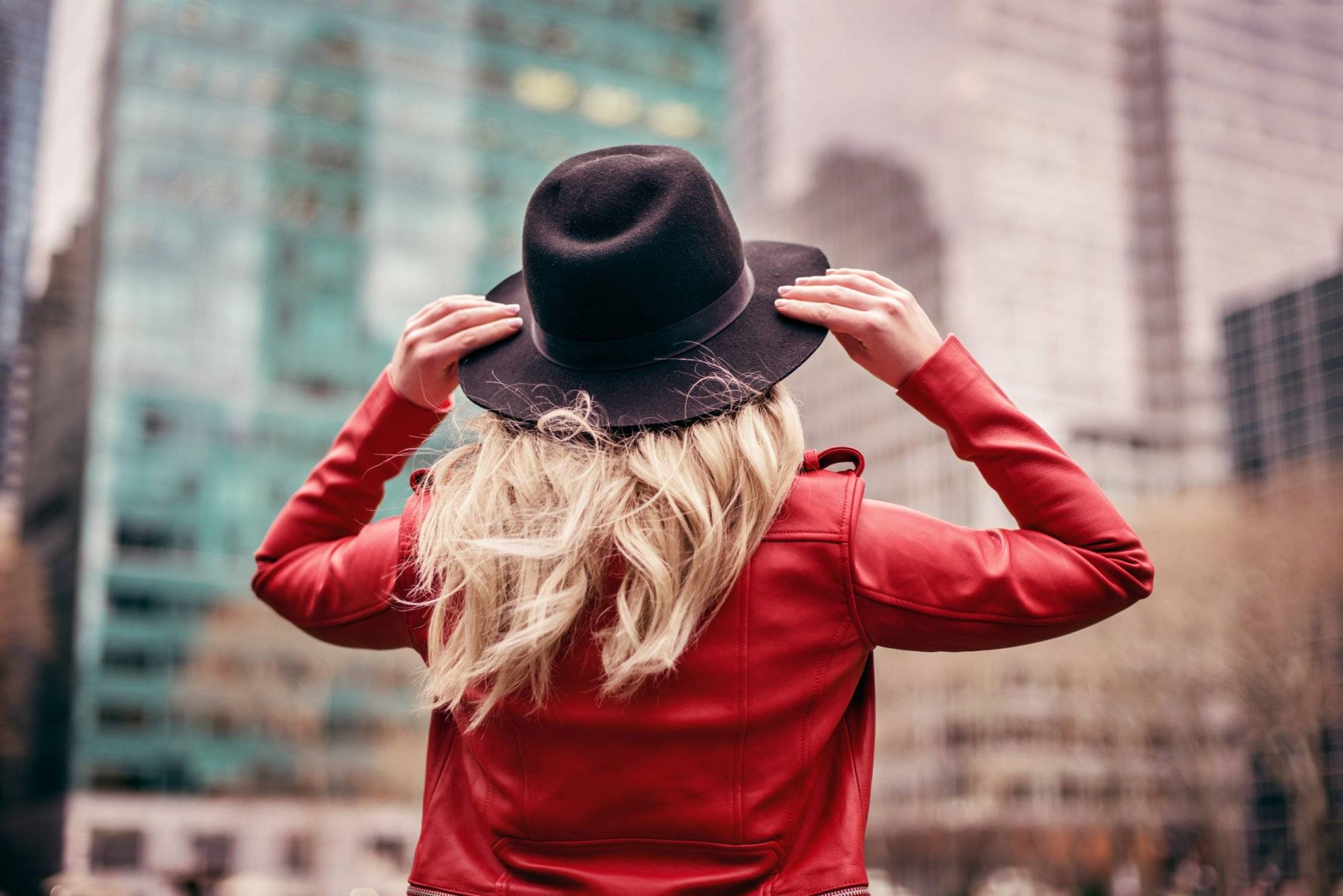 young woman wearing hat walking on streets of New York young woman wearing hat walking on streets of New York