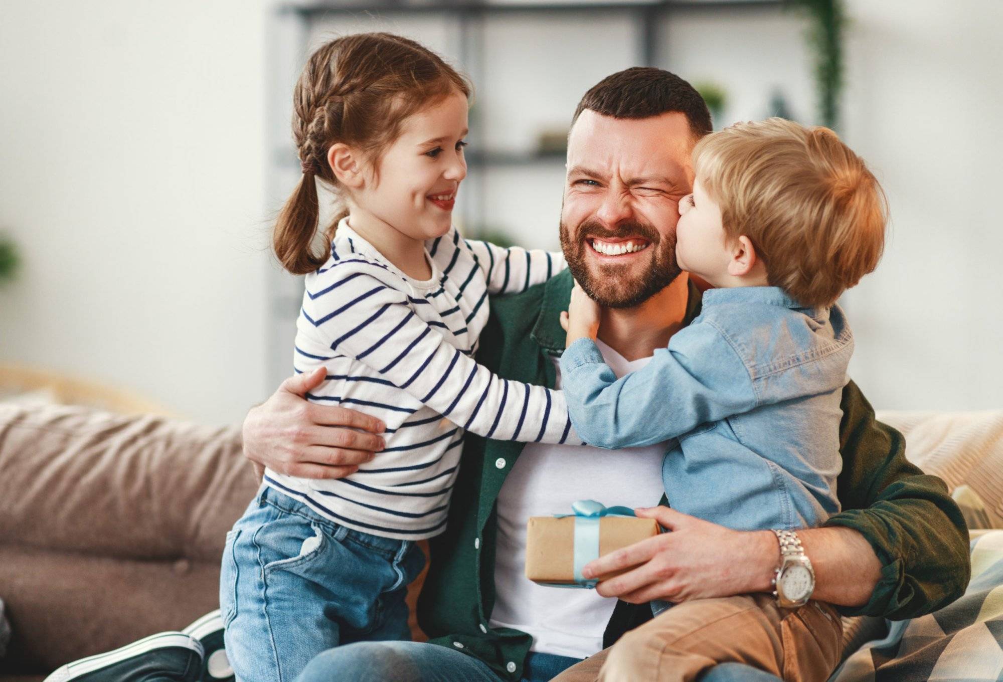 Happy father getting congratulations from kids