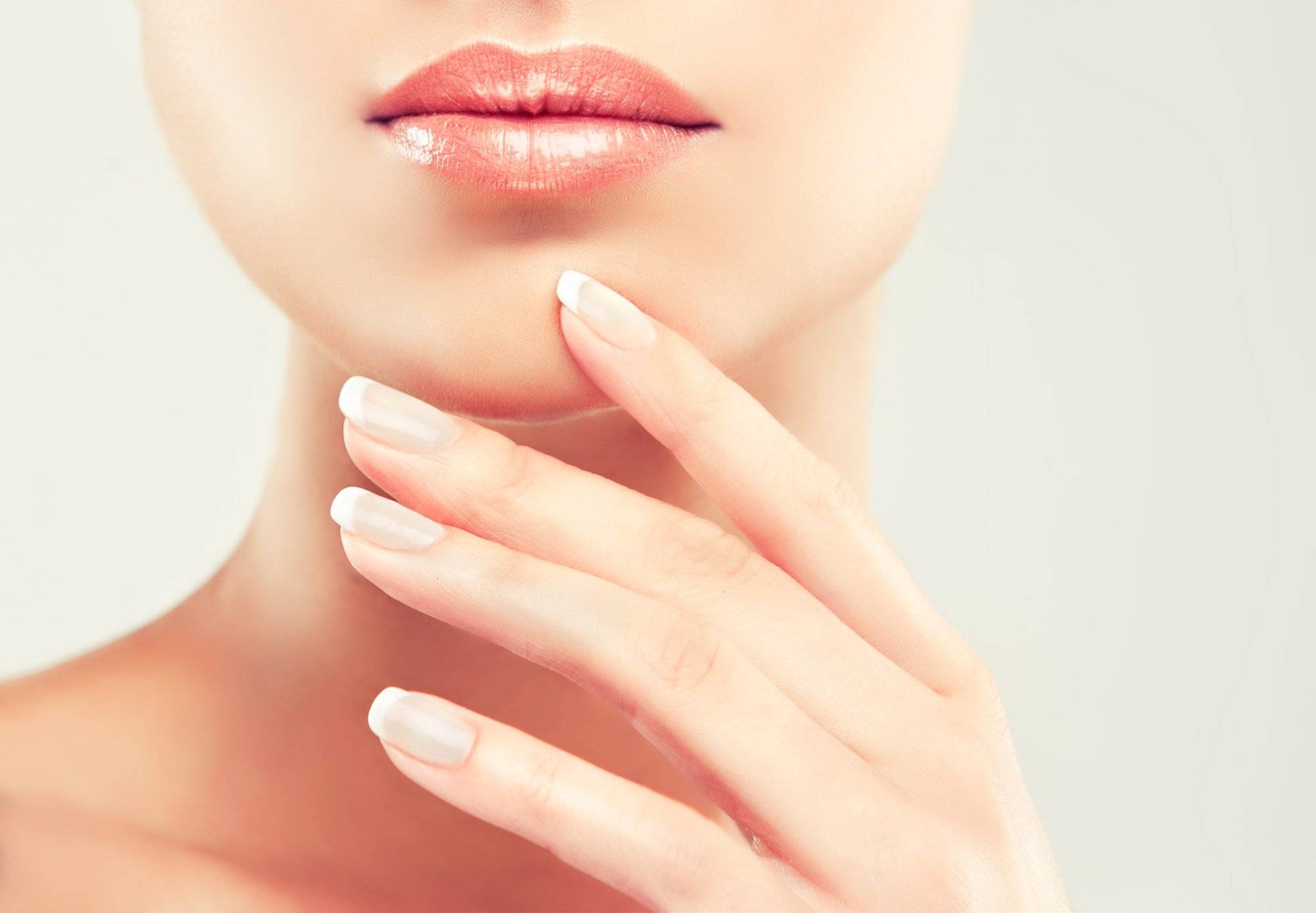 Beauty Spa Woman Portrait. Beautiful Girl Touching her Face